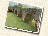 FREE POSTCARD: Portion of the Mona aqueduct that runs through the UWI Mona campus by the ring road